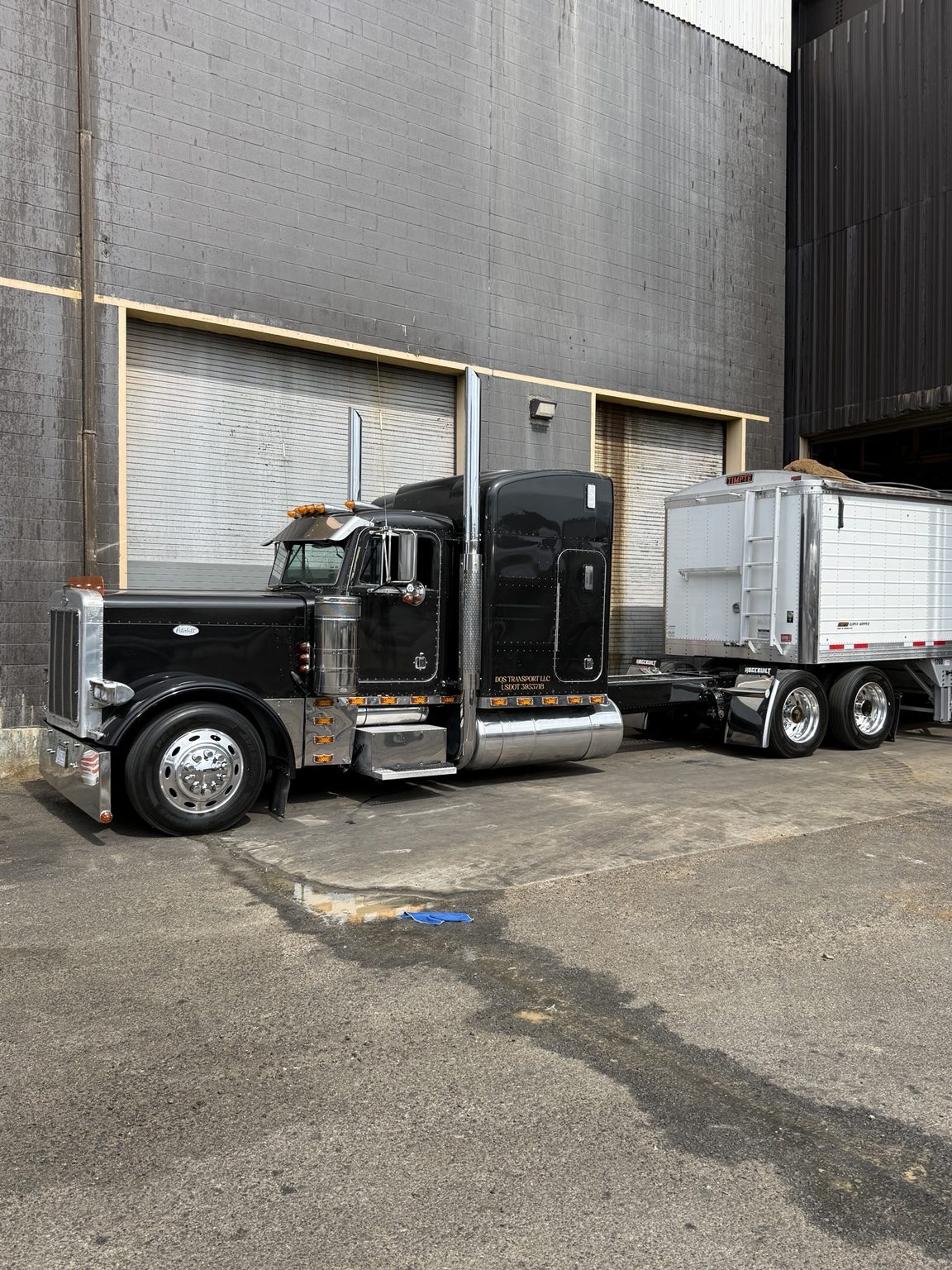 DQS Transport truck at an industrial loading bay
